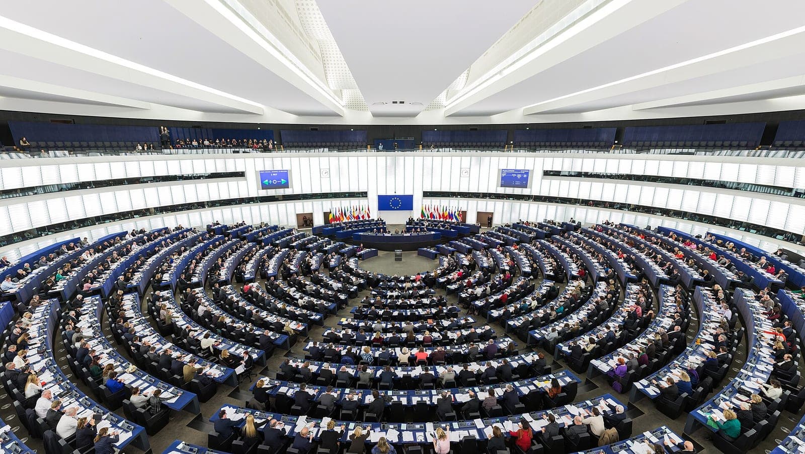 The hemicycle debating chamber of the European Parliament in Strasbourg, filled during a plenary session.