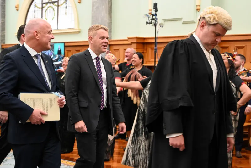 Christopher Luxon and Chris Hipkins 2023 - State Opening of the 54th Parliament, on 6 December 2023. They are led by the clerk-assistant of the Office of the Clerk of the House of Representatives, James Picker.