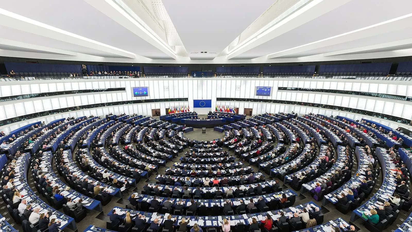 The hemicycle debating chamber of the European Parliament in Strasbourg, filled during a plenary session.