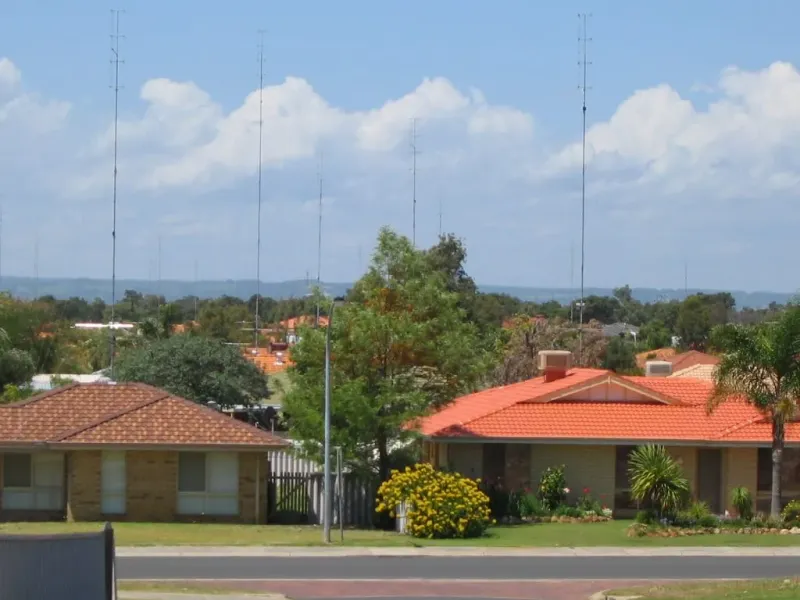 Brick-and-tile suburban houses with neat gardens in Eaton, Western Australia