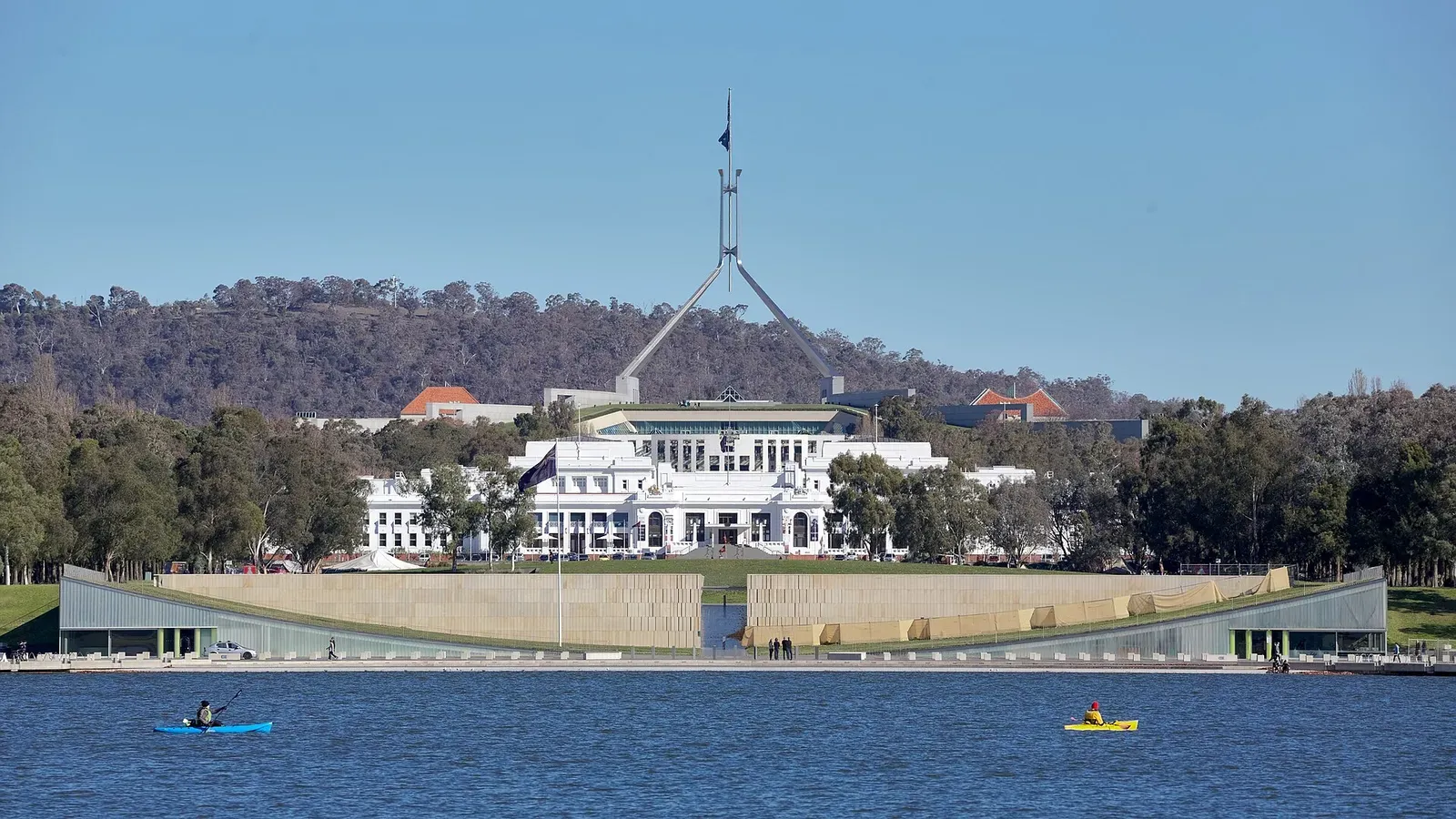 View from Lake Burley Griffin, in Canberra Australia. The older white building is Old Parliament House; the building behind it is the new Parliament House.
